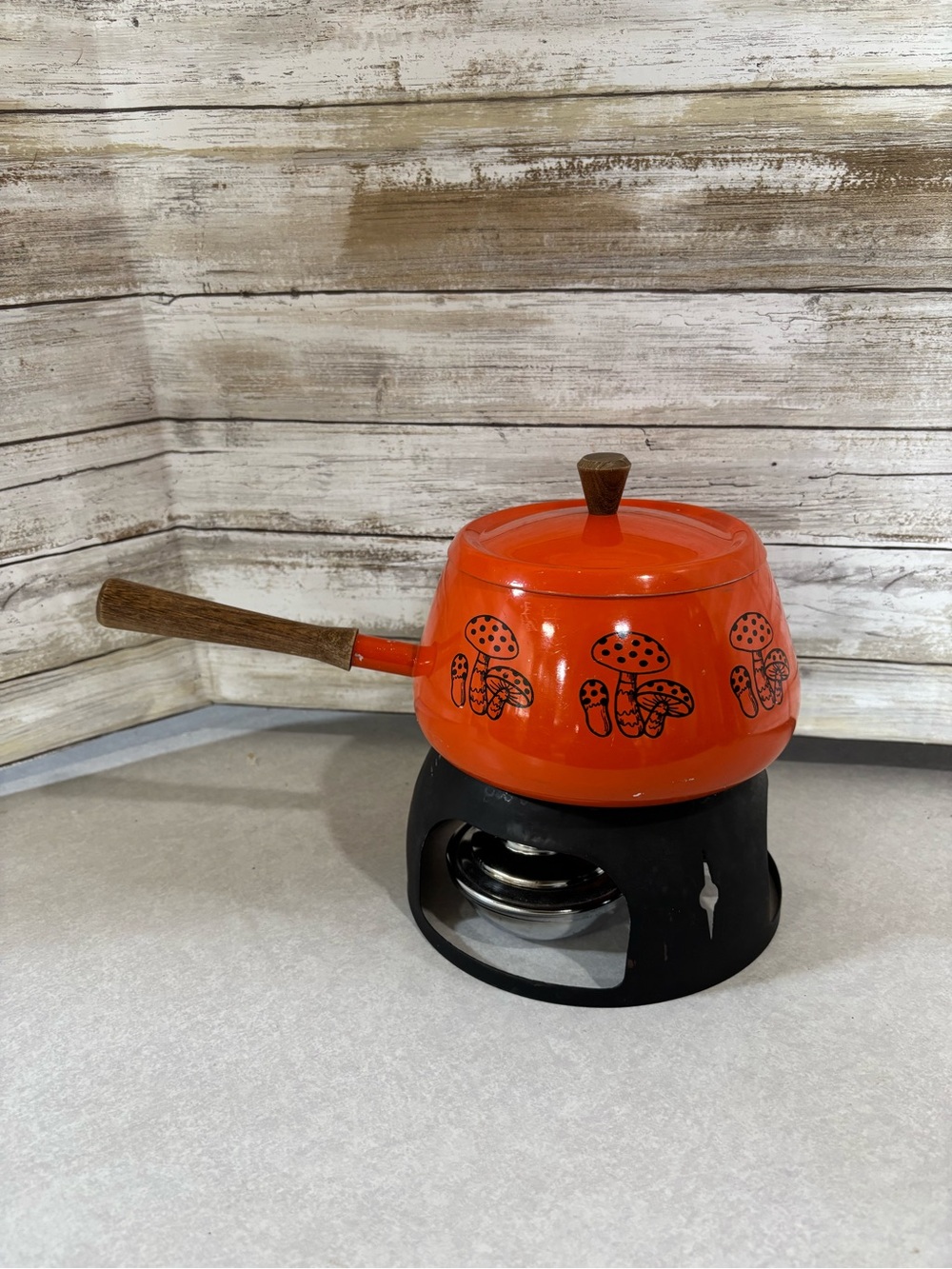 Bright orange vintage fondue pot mushroom design